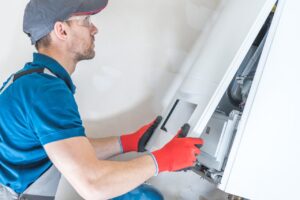 A professional technician installing a new Furnace system 